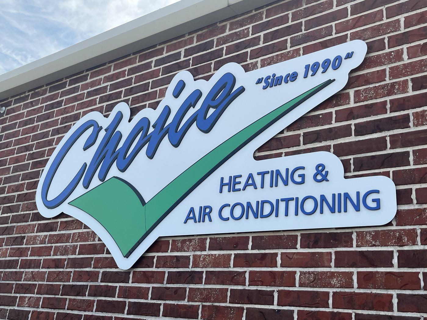 Choice Heating and Air Conditioning logo sign on the shop building