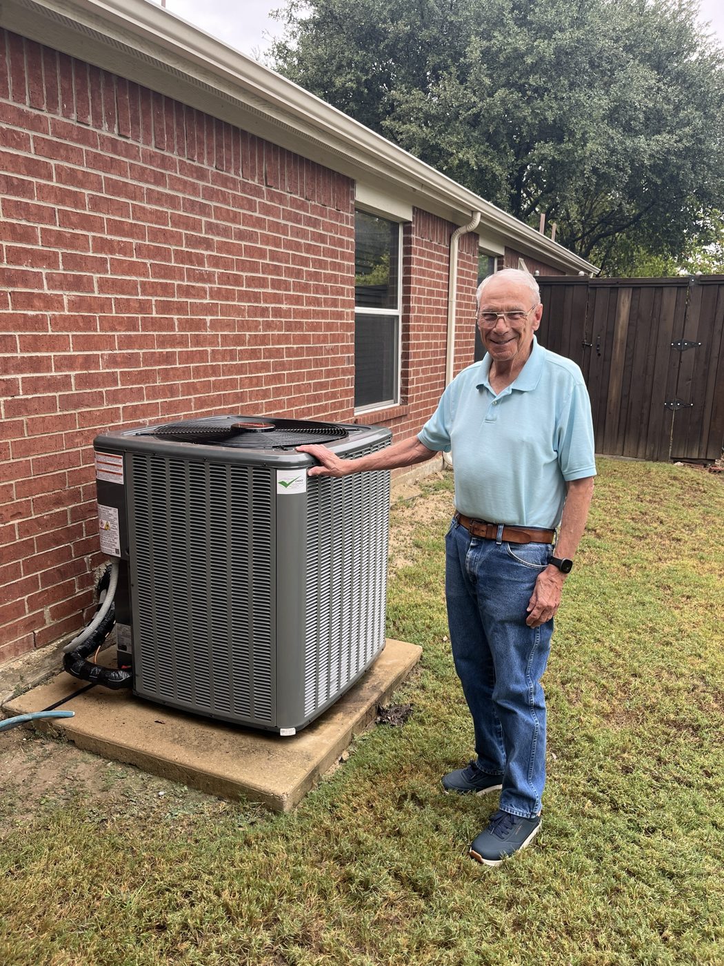 Happy customer with his newly installed outdoor AC unit